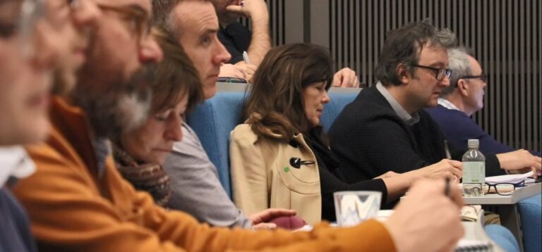 People listening at a conference