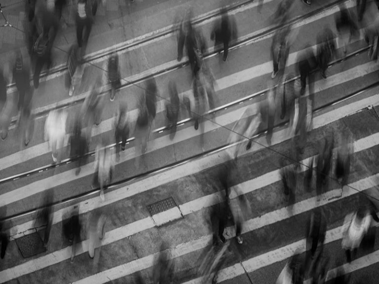 And Image of people moving along a highstreet